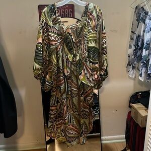 Jungle print, long back shirt, with fitted mesh, and off or on long sleeves.